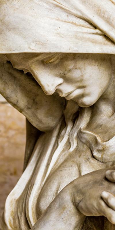 Marble statue of a person looking downward