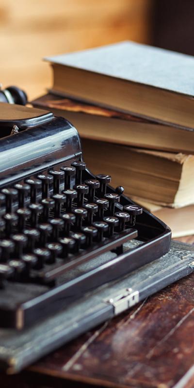 Typewriter and books